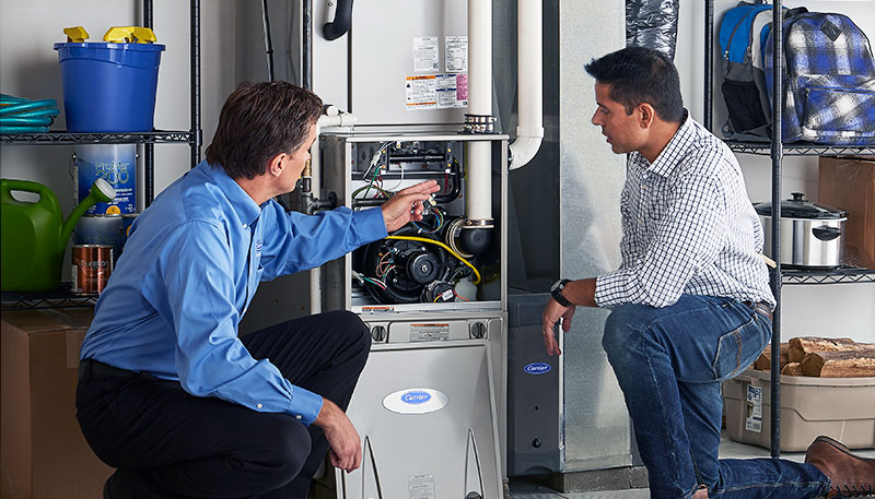 HVAC technician evaluating a furnace for repair or replacement in Saratoga Springs